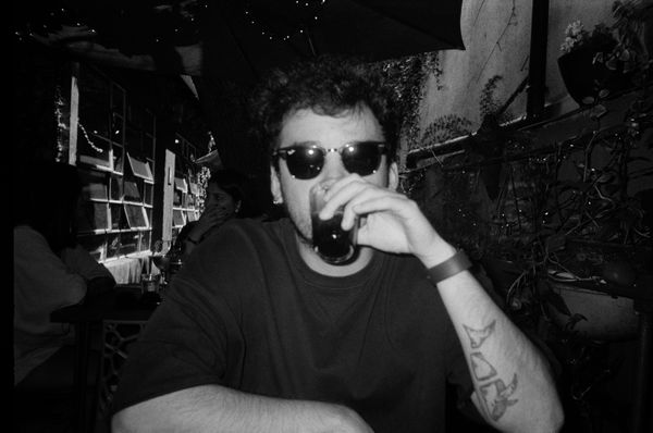 Black and white photo of me driking a coup of coke